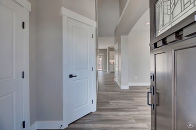 (PHOTO OF SIMILAR HOME)Hall featuring light wood-style floors and recessed lighting