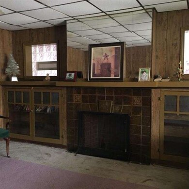 Living Room has decorative fire place and built-in