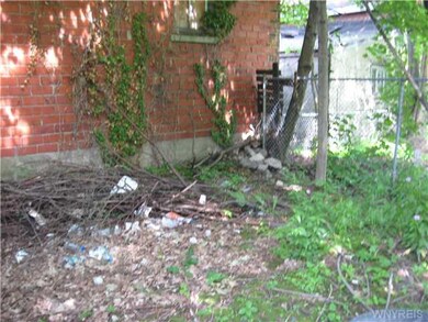 Landscaping Fenced in yard behind rear house