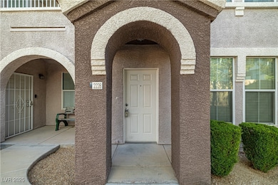 Property entrance featuring stucco siding