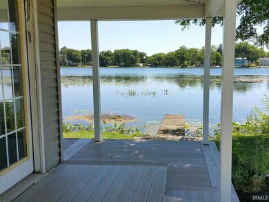 Covered porch entry looking east.