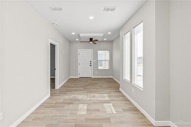 Entrance foyer with baseboards, light wood-style floors, recessed lighting, and a ceiling fan