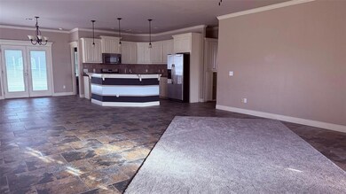 Kitchen with open floor plan, a notable chandelier