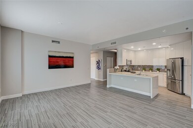 Kitchen with open floor plan, a peninsula, stainle