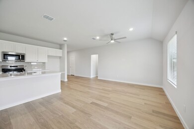 Living Room in the Hadley home plan by Trophy Signature Homes – REPRESENTATIVE PHOTO
