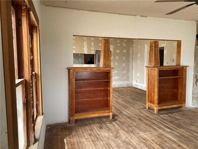looking through bookcases into dining area