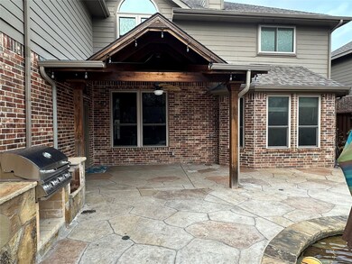 Pool patio with built in grill.