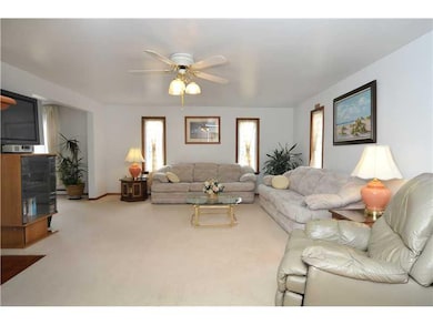 Living Room. NEUTRAL CARPETING FLOWS THROUGHOUT FI