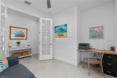 Home office with baseboards and light tile patterned flooring