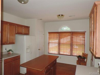 Hardwood flooring in kitchen, wood shutters compli