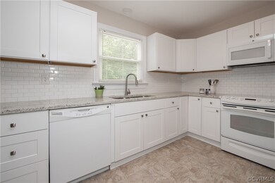 Newly renovated kitchen with new cabinetry, granit