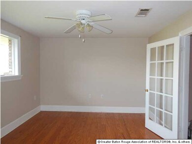 Dining room or office with wood floors located jus