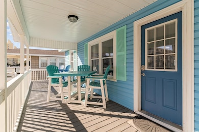 Wooden terrace featuring a porch