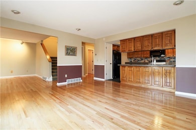 View from dining room to living room, with kitchen