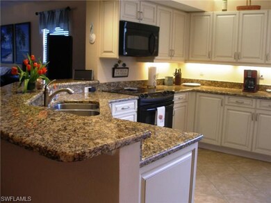 The breakfast bar wraps around into the living room and is adjac