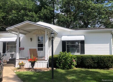View of front of home featuring a porch and a front yard