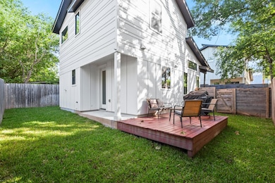 Back of property with board and batten siding, a 