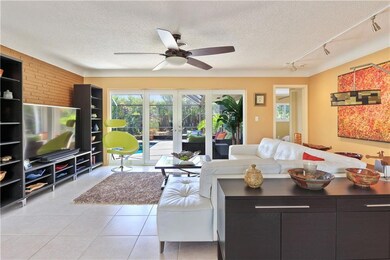 Expansive living space looking out to the tranquil setting of your newly done pool and backyard.