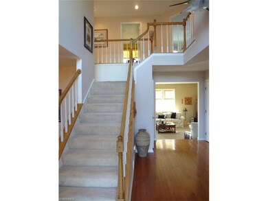 2 story foyer, real hard wood flooring leads to 1s
