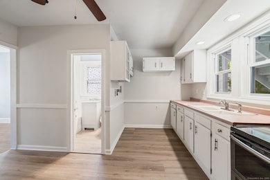 Unit 1: 1st floor: kitchen with laundry hookups