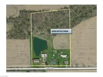 5.5 acres with pond and 6 outbuildings plus home