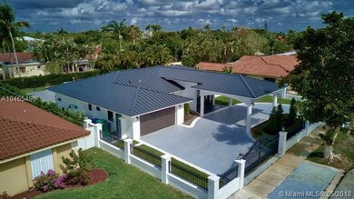 Aerial view from the south. Property wall with met