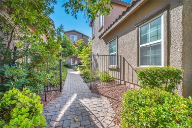 Stroll through private pathways framed by lush greenery and gated entries, offering a serene approach to your front door.