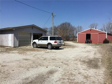 Detached garage on the left with the sidewalk lead
