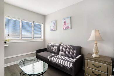 Living room with wood finished floors and baseboards
