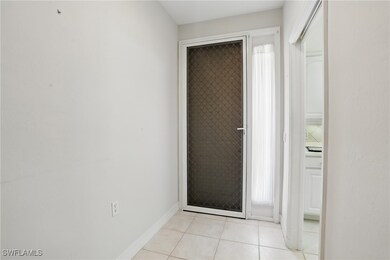 Doorway to outside with light tile patterned floor