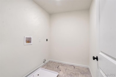 Washroom featuring electric dryer hookup and washer hookup