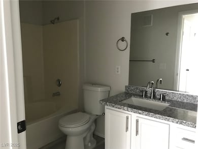 Bathroom with shower / tub combination and vanity