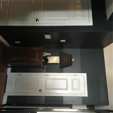The transition from living room to kitchen is elegant too