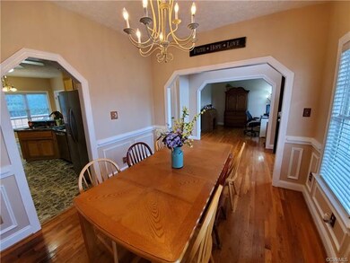 Formal Dining Room with view of the Foyer and the Eat-in Kitchen.