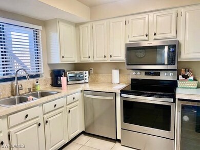 Kitchen featuring stainless steel appliances, wine