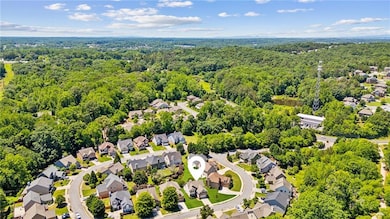 Aerial view of residential area with a heavily wooded area