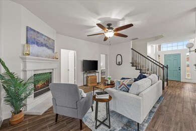 Living room with dark wood-type flooring and ceili