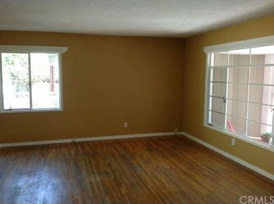 Spacious Living Room with Large Picture Window and