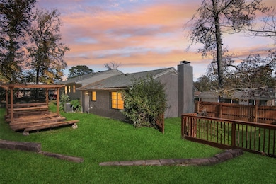 Charming backyard with a well-maintained lawn, woo