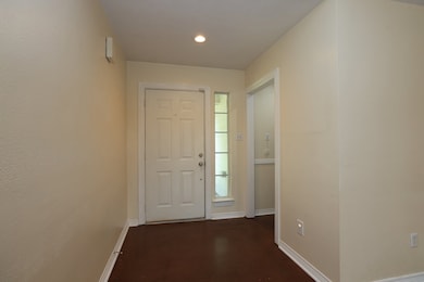 This photo shows a functional entryway with a whit