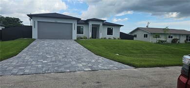 View of front of home with decorative driveway, st