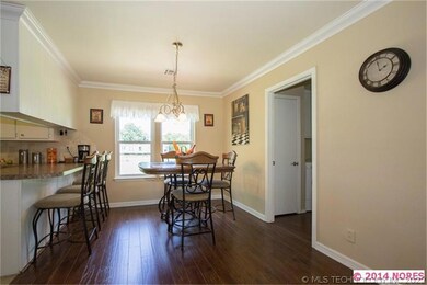 The cheerful Dining Area has ample space for a chi