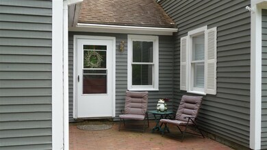 Enter this home via a brick patio that leads to th