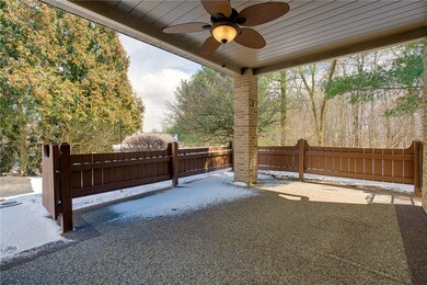 Spacious covered porch with overhead fan, perfect