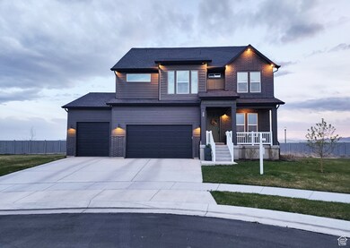 Contemporary home featuring driveway, brick siding, a porch, an attached garage, and a shingled roof