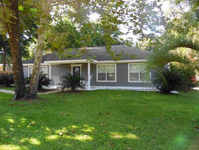 Front yard, RV parking spot on left side of home behind privacy fence