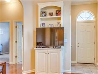 Foyer, front bedrooms, and built in shelve