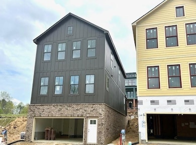 Rear of the home with 2 car garage