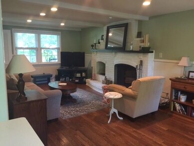 Relax in the first floor familyroom with log burni