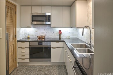 Kitchen with high-end appliances, custom backsplas
